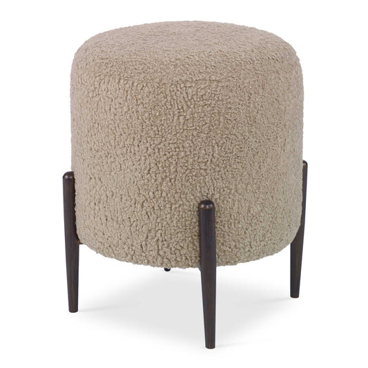 This Plush Ottoman Is Covered In A Luxurious Latte Faux Shearling, Suspended Within Dark Bronze Finished Metal Legs. Versatile And Stylish, This Piece Can Be Used As A Seat Or Footrest, Grouped Together Or As A Singular Accent Piece.