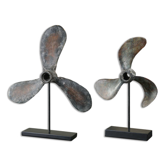 Reproduction Boat Propellers, A Conversation Piece In Any Room.  Cast From Old Propellers, These Items Show The Natural Wear And Imperfections Of The Originals.  The Finish Is A Rust Brown With Green Tarnish And A Gray Glaze.  The Steel Base Is Matte Black. Sizes: S-11x18x4, L-16x21x4