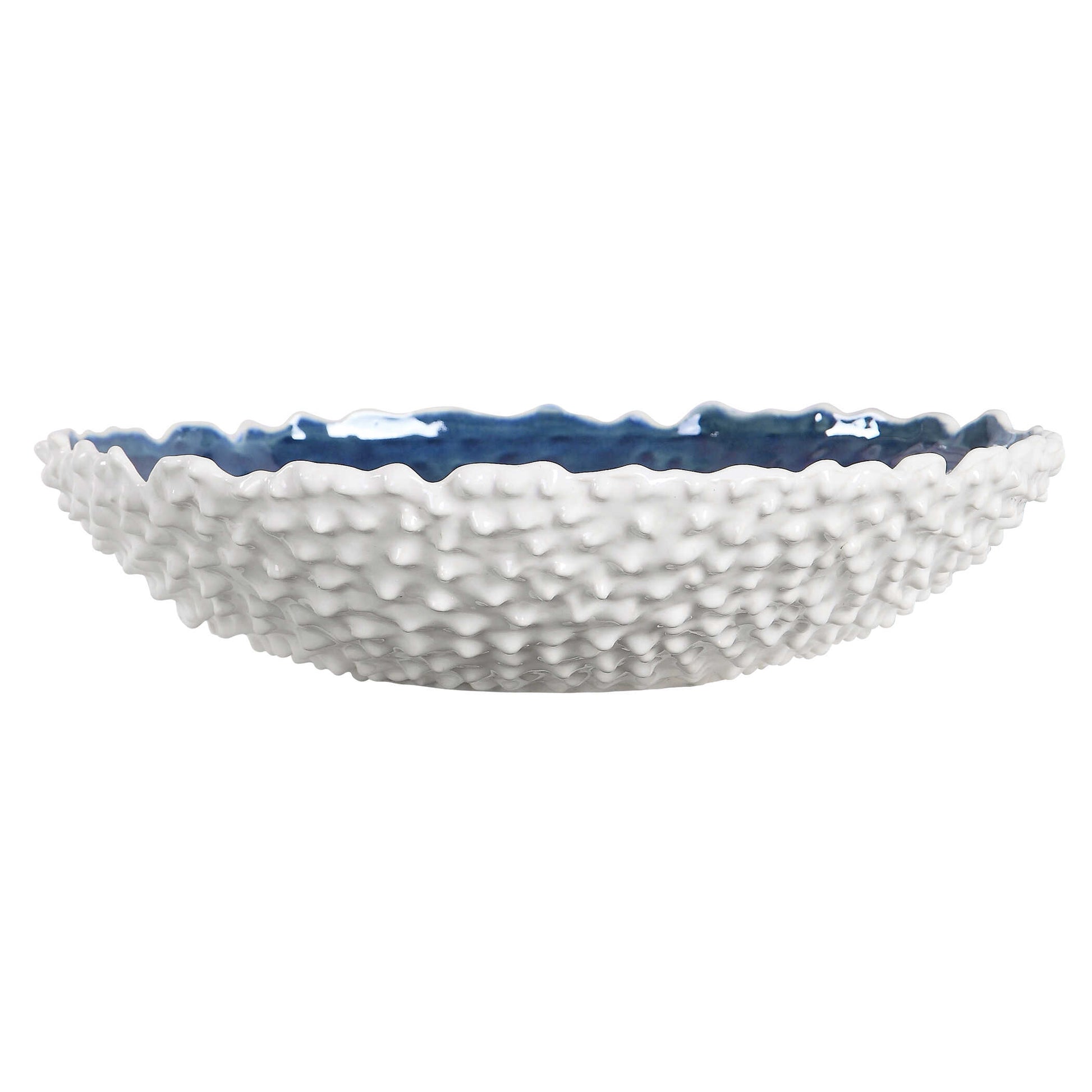 White Ceramic Bowl With Heavy Outer Texture And A Bright Blue Interior Glaze.