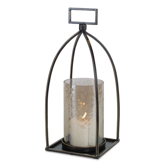 Taking Cues From Moroccan Style, This Candleholder Is Finished In Dark Bronze With Gold Rub-through Details And A Textured Glass Hurricane. One White 3"x 3" Candle Is Included.