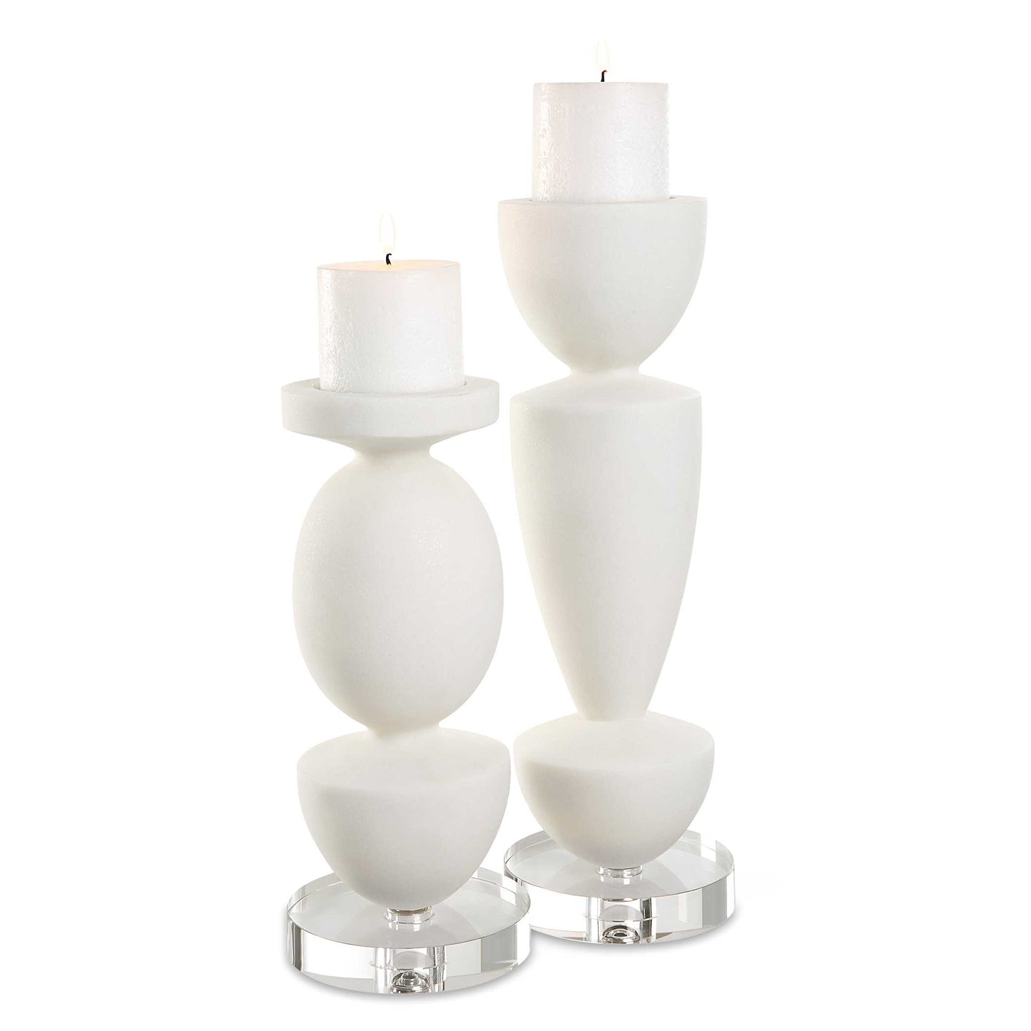 Sculptural Candle Holders Crafted From Ivory Man-made Stone That Accurately Replicates The Look Of Thassos Marble And Is Accented By An Elegant Crystal Foot. Includes Two, 3x3 Distressed White Candles. Sizes: S-5x12x5, L-5x16x5
