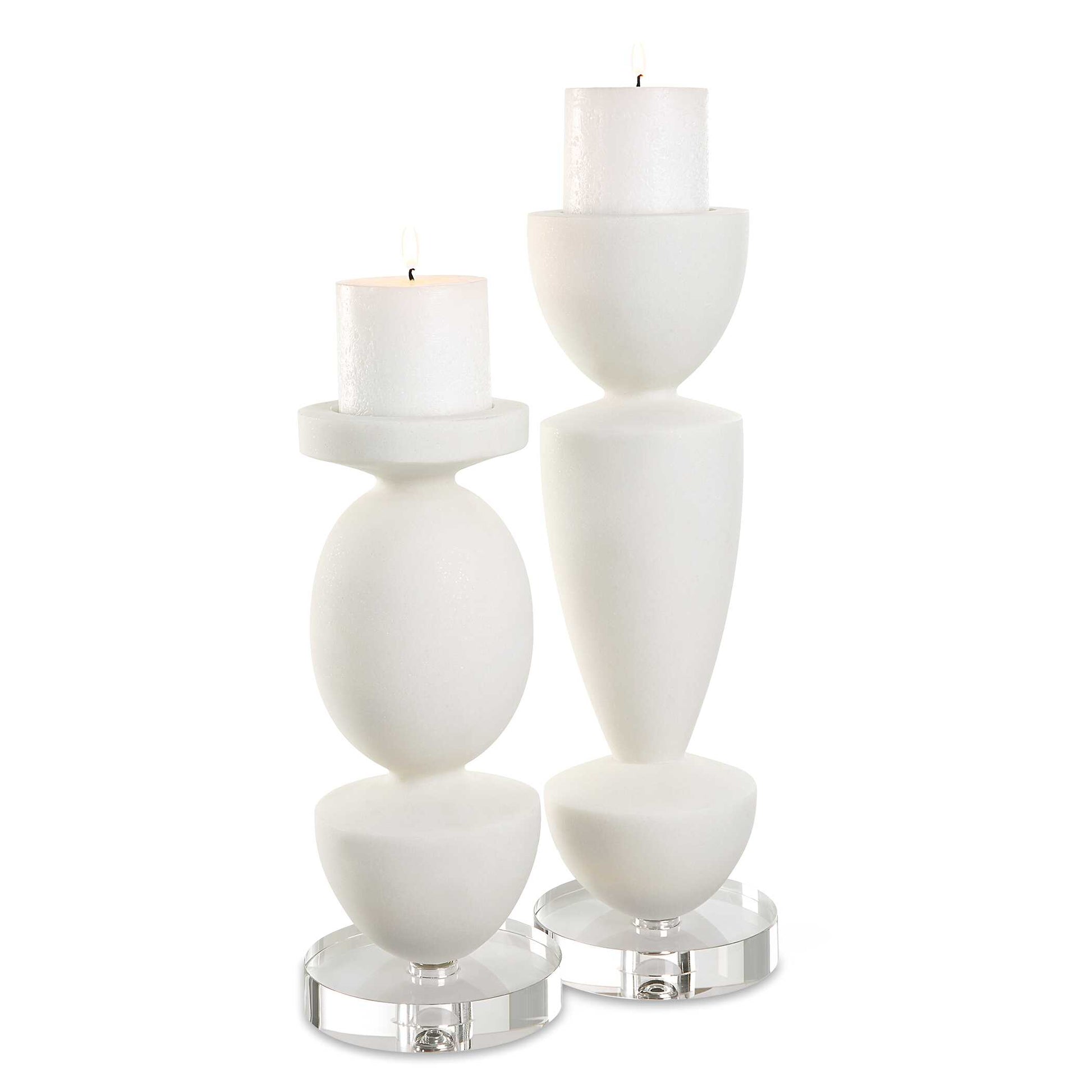 Sculptural Candle Holders Crafted From Ivory Man-made Stone That Accurately Replicates The Look Of Thassos Marble And Is Accented By An Elegant Crystal Foot. Includes Two, 3x3 Distressed White Candles. Sizes: S-5x12x5, L-5x16x5
