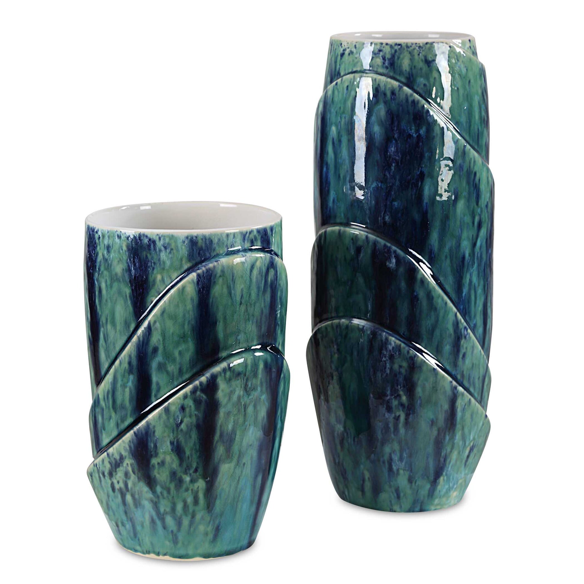 Introducing Our Stunning Set Of Two Ceramic Vases, A Harmonious Blend Of Nature's Hues. Crafted With Care And Adorned In A Captivating Blue And Green Reactive Glaze, Each Vase Boasts A Unique, Organic Pattern. The Interior Is Finished In A Pristine White Glaze, Providing The Perfect Contrast To Showcase Your Blooms. Sizes: S- 6x10x6, L- 6x15x6