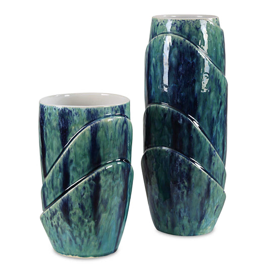 Introducing Our Stunning Set Of Two Ceramic Vases, A Harmonious Blend Of Nature's Hues. Crafted With Care And Adorned In A Captivating Blue And Green Reactive Glaze, Each Vase Boasts A Unique, Organic Pattern. The Interior Is Finished In A Pristine White Glaze, Providing The Perfect Contrast To Showcase Your Blooms. Sizes: S- 6x10x6, L- 6x15x6