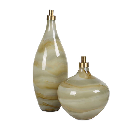 These Exquisite Glass Bottles Feature A Captivating Swirl Pattern Of Grays, Caramels, And Ivories, Creating A Stunning Visual Effect That Enhances Any Decor. Each Bottle Is Topped With A Stylish Antique Brass Finished Topper, Adding A Touch Of Sophistication And Charm. Sizes: S-8x10x8, L-6x17x6