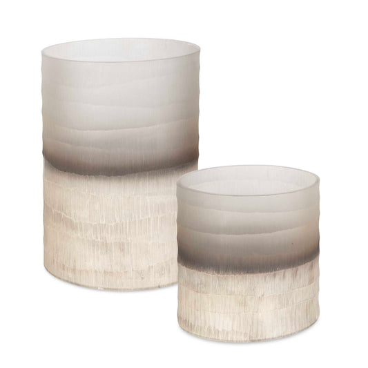 These Modern Cylindrical Vases Feature A Soft Gradient Design With Textured Horizontal Lines, Offering A Subtle Yet Sophisticated Look. Perfect For Adding A Touch Of Elegance To Any Space, Their Neutral Tones Complement A Variety Of Interior Styles. Ideal For Displaying Floral Arrangements Or As Standalone Decor Pieces. Sizes: S-8x9x8, L-9x13x9