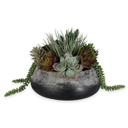 A Stunning Centerpiece Full Of Life-life Succulents And Sedum Varieties. Deep Tones Of Green And Burgundy Add To Its Richness, Complementing The Dark Iron Planter With Antiqued Edge Accents.
