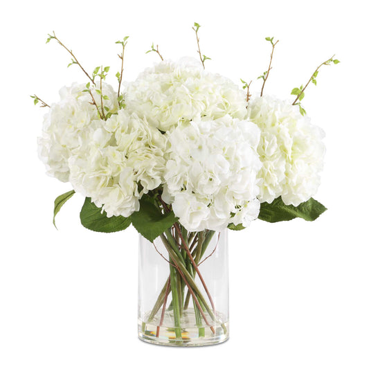 Elegance And Simplicity Is Displayed In The Anastasia Hydrangea Centerpiece. Lush Blooms Of Cream Hydrangeas With Natural Foliage Accents Are Effortlessly Placed Into A Glass Vase, Complete With Faux Water.