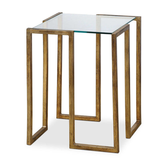 An Artful Accent Table Featuring A Contemporary Forged Iron Design Finished In Antique Gold Leaf With A Clear Tempered Glass Top.