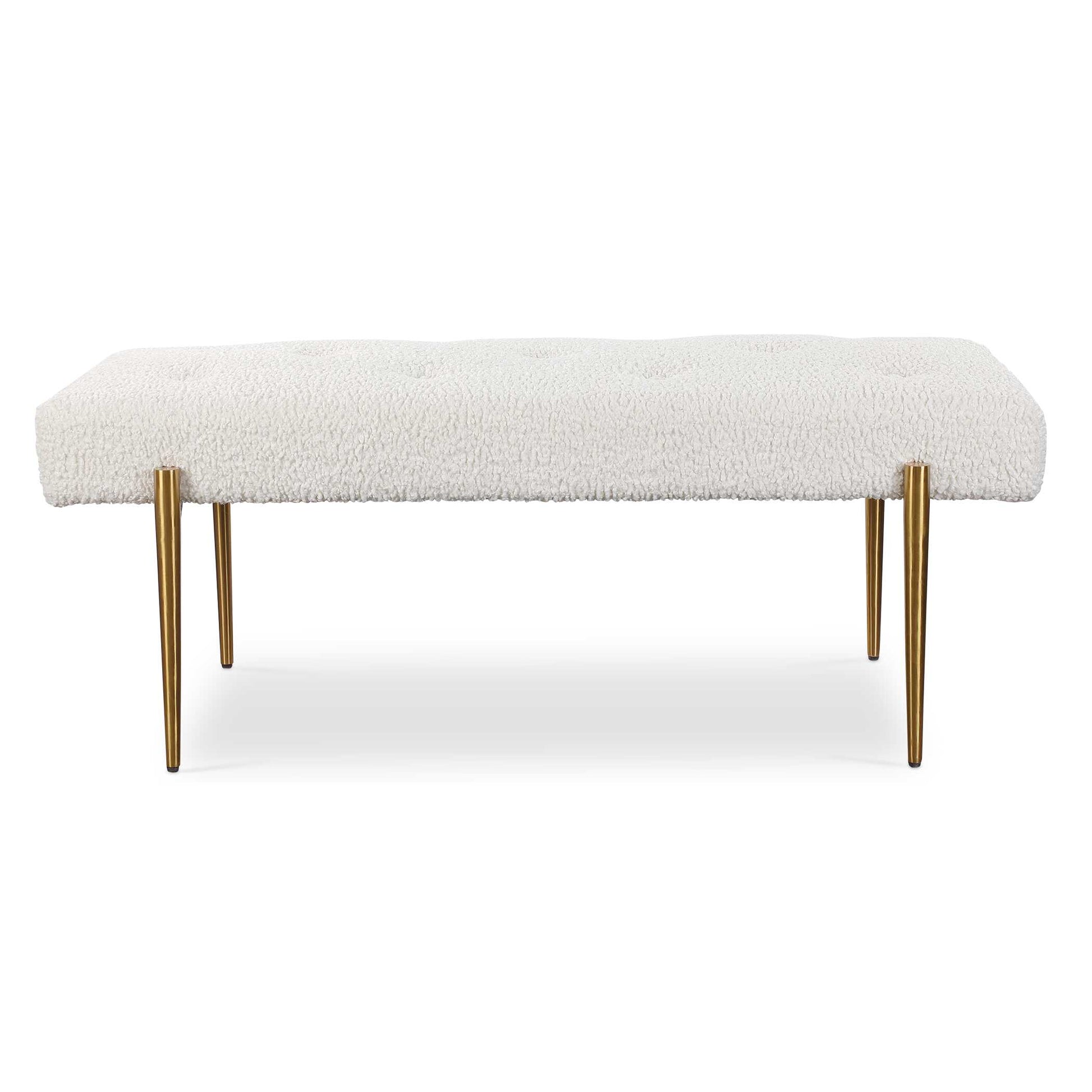 Expertly Tailored In White Faux Shearling, This Glamorous Accent Bench Features A Plush Button Tufted Seat, Atop Four Tapered Stainless Steel Legs Finished In Antique Brushed Brass.