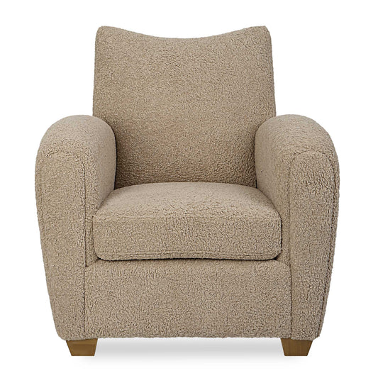 With Its Curved Track Arms And Supportive Back, This Cozy Accent Chair Is The Perfect Balance Of Comfort And Style. Fully Upholstered In A Soft Latte Toned Faux Shearling And Accented By Walnut Stained Wooden Feet.