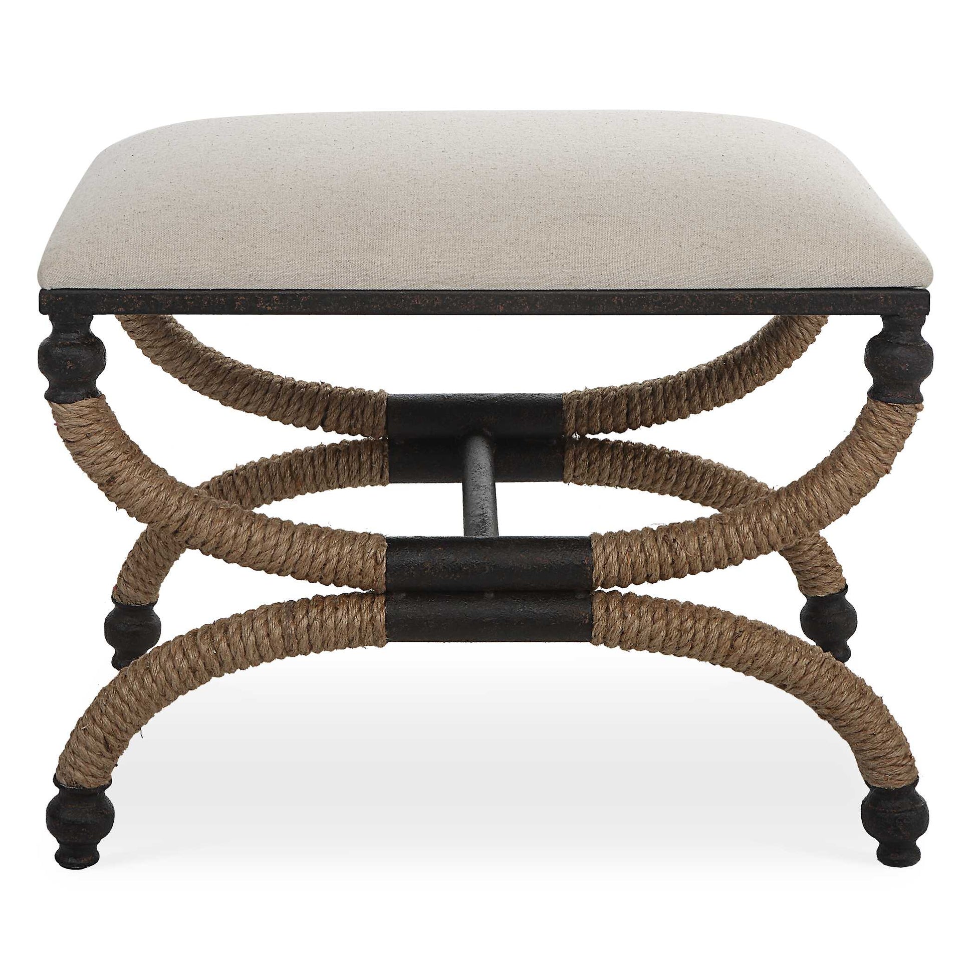 The Icaria Bench Features A Rustic Curved Iron Frame With A Nautical Touch, Wrapped In Natural Fiber Rope Accents. The Cushioned Top Is Upholstered In An Oatmeal Cotton Blend Fabric.