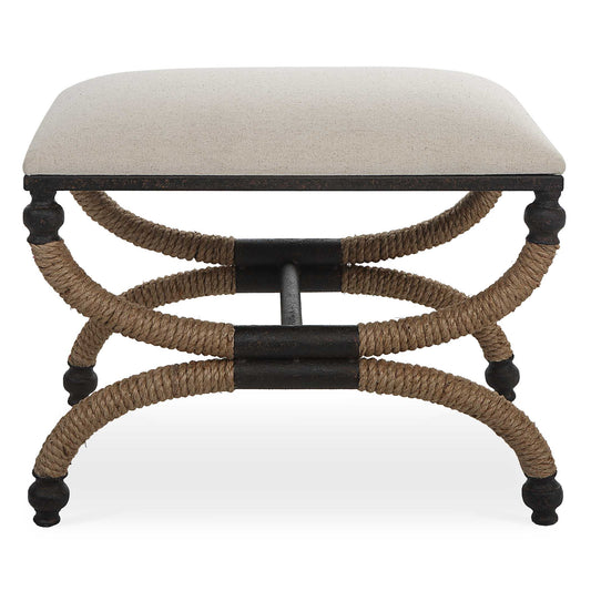 The Icaria Bench Features A Rustic Curved Iron Frame With A Nautical Touch, Wrapped In Natural Fiber Rope Accents. The Cushioned Top Is Upholstered In An Oatmeal Cotton Blend Fabric.