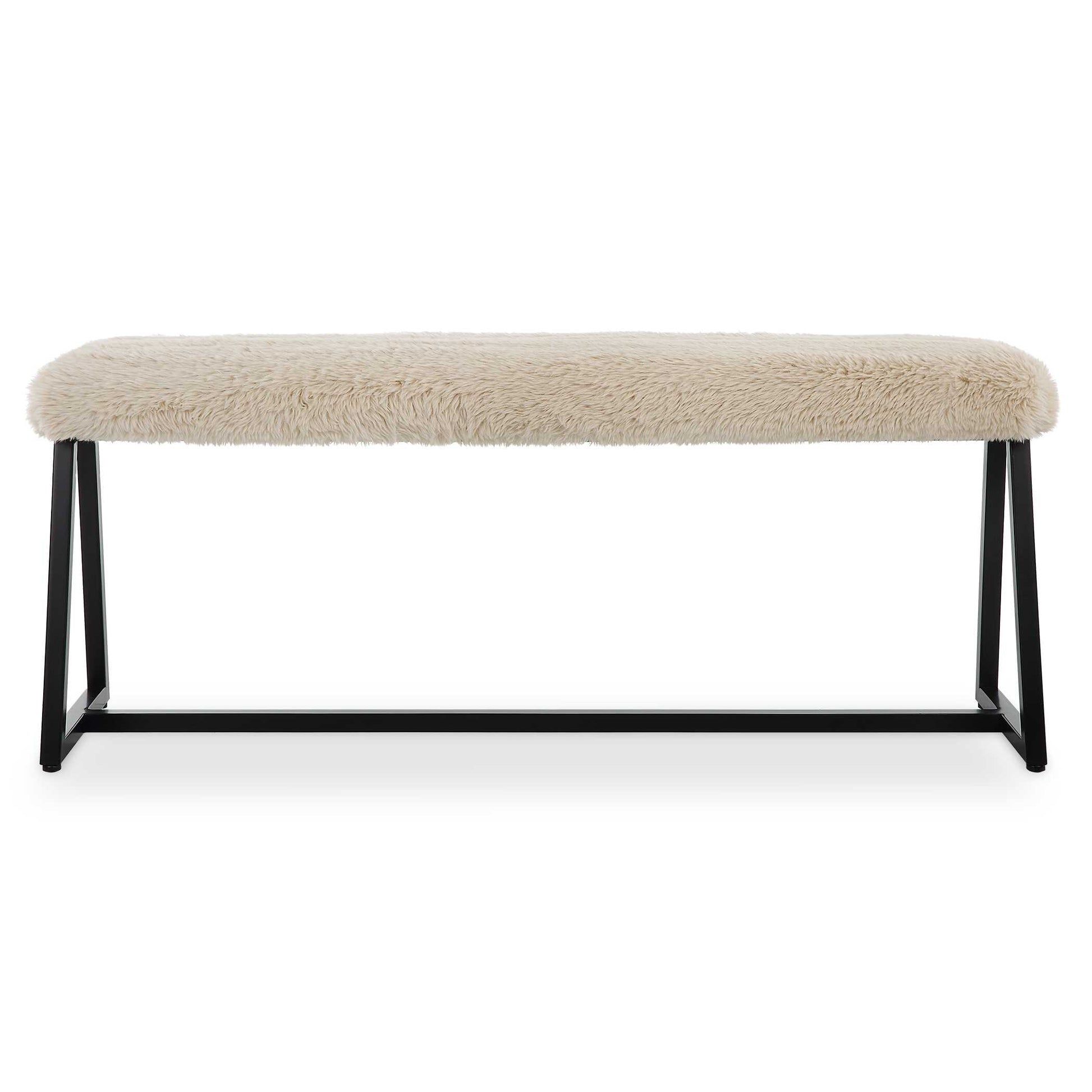 A Space Saving Seating Solution Featuring A Slim Bench Seat Upholstered In Plush Long Haired Faux Sheepskin In A Toasty Beige Over A Matte Black Finished Iron Base. Seat Depth Is 8".