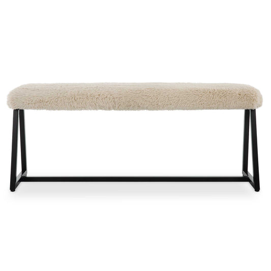 A Space Saving Seating Solution Featuring A Slim Bench Seat Upholstered In Plush Long Haired Faux Sheepskin In A Toasty Beige Over A Matte Black Finished Iron Base. Seat Depth Is 8".