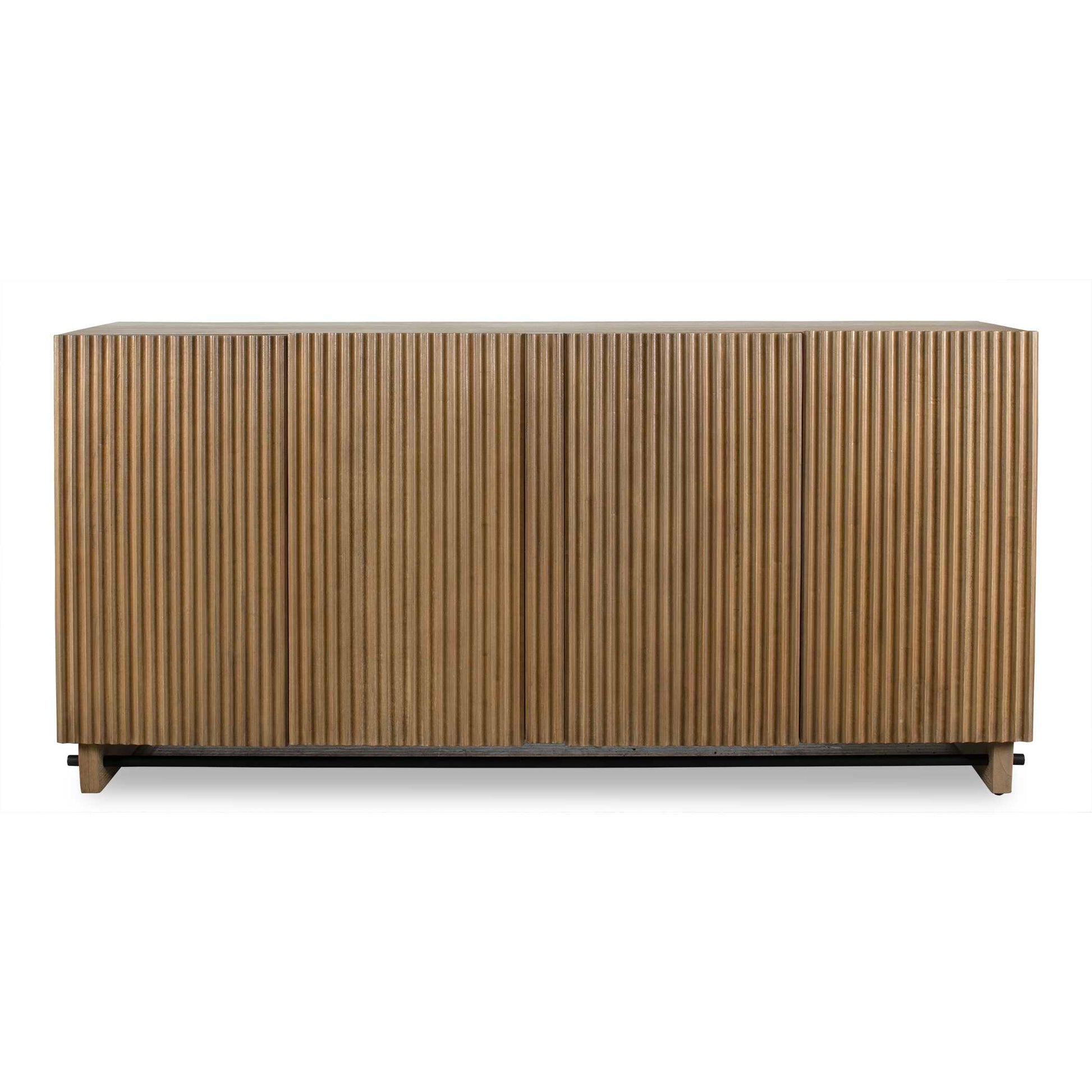 This Mindi Veneer Cabinet Boasts A Warm, Natural Wood Finish, Highlighted By A Captivating Fluted Texture On The Doors, Adding Depth And Character To Its Design. It Is Complemented By An Accent Stretcher Finished In Matte Black.