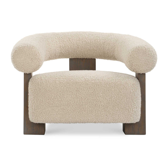 The Lennox Accent Chair Features A Solid Oak Frame With A T Back Design Finished In Dark Walnut. The Floating Barrel Back And Cushion Are Upholstered In A Linen Toned Faux Shearling.