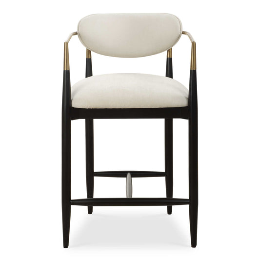 The Sleek Wraparound Frame Of The Moxie Counter Stool Exudes Style And Sophistication. The Tapered Solid Wood Frame Is Finished In Matte Black And Accented By Metal Arms In Plated Brushed Brass. Its Plush Seat And Back Is Upholstered In A Finely Textured Off White, Low Pile Velvet.