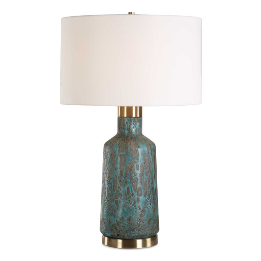 The Dauphine Table Lamp Features A Glass Base With A Dark, Crackle Textured Coating, Covered In A Volcanic-inspired Deep Teal Glaze, Paired With Antique Brass Plated Details.