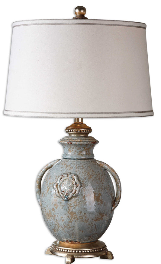 Textured Ceramic Finished In A Distressed Light Blue Glaze With Rust Undertones, Tan Glaze And Silver Leaf Details.